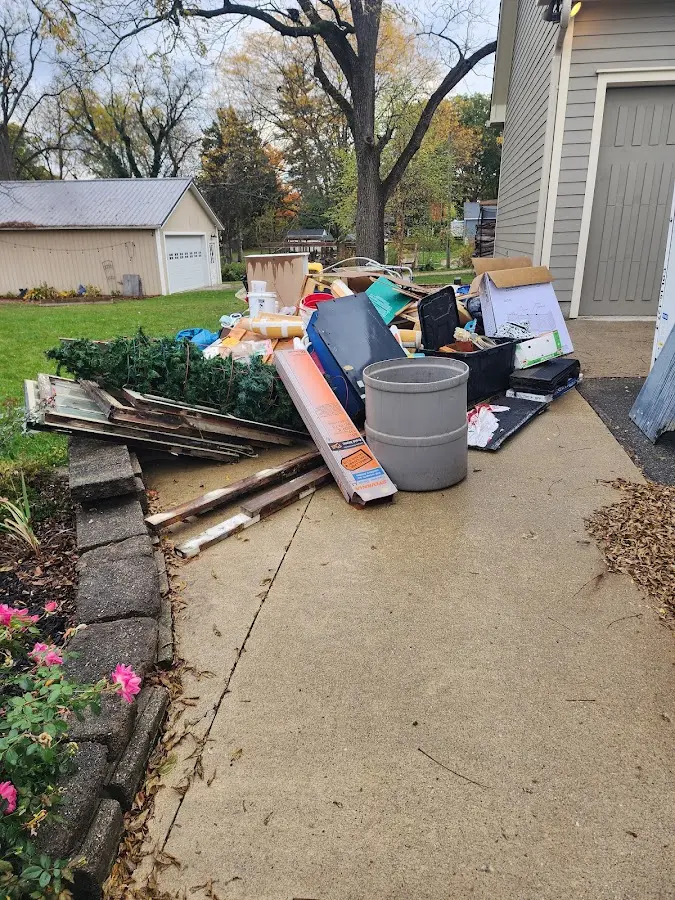Dumpster being loaded with debris for Residential Dumpster Rental in Callicoon